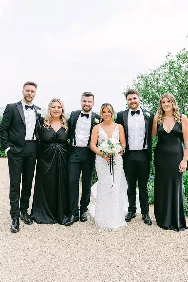 Summer Wedding Group In Garden Setting