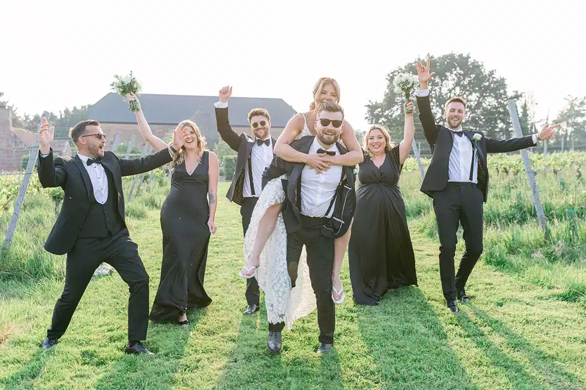 Wedding Party Celebrate In Barn Field